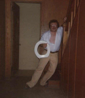 Dick holding a toilet seat